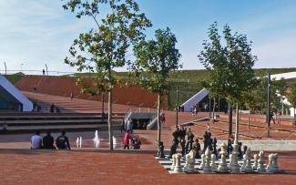 Pitched green roofs surrounding a plaza