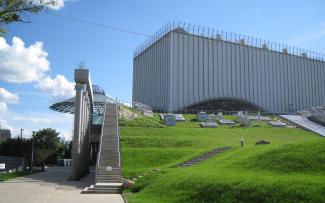 Building and staircases surrounded by lawn